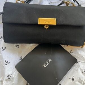 TUMI Black and Gold Clutch